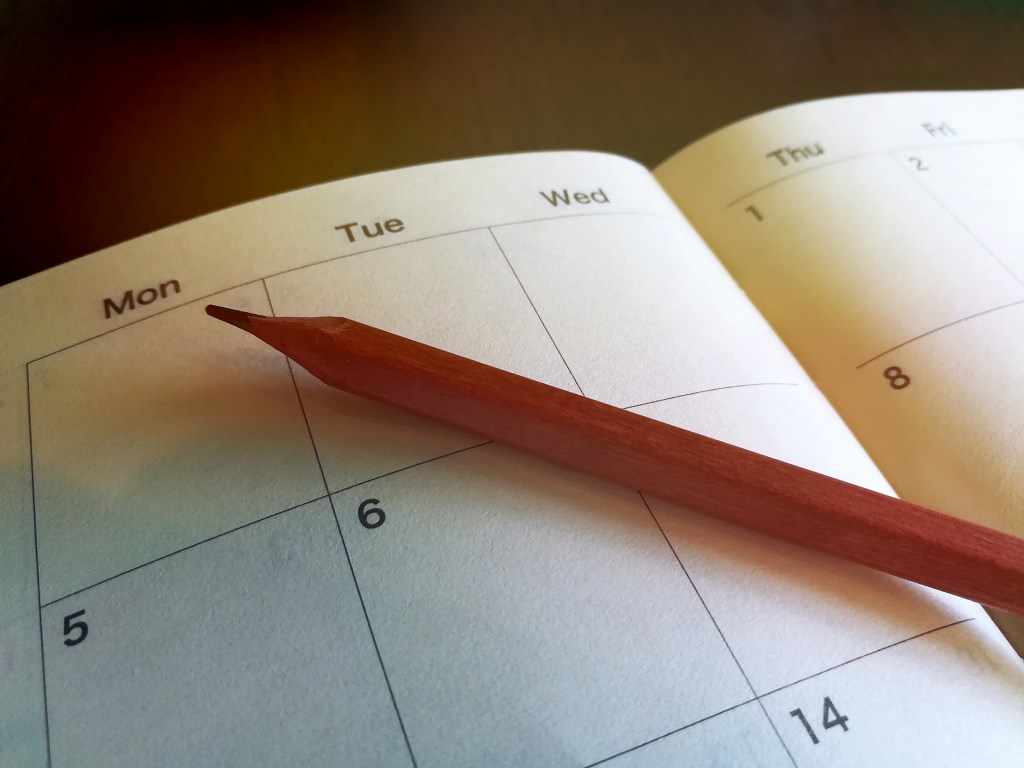 Pencil on calendar/planner page.